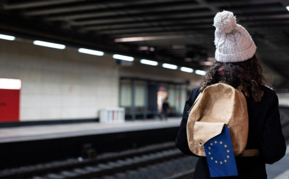 a girl waiting for a train